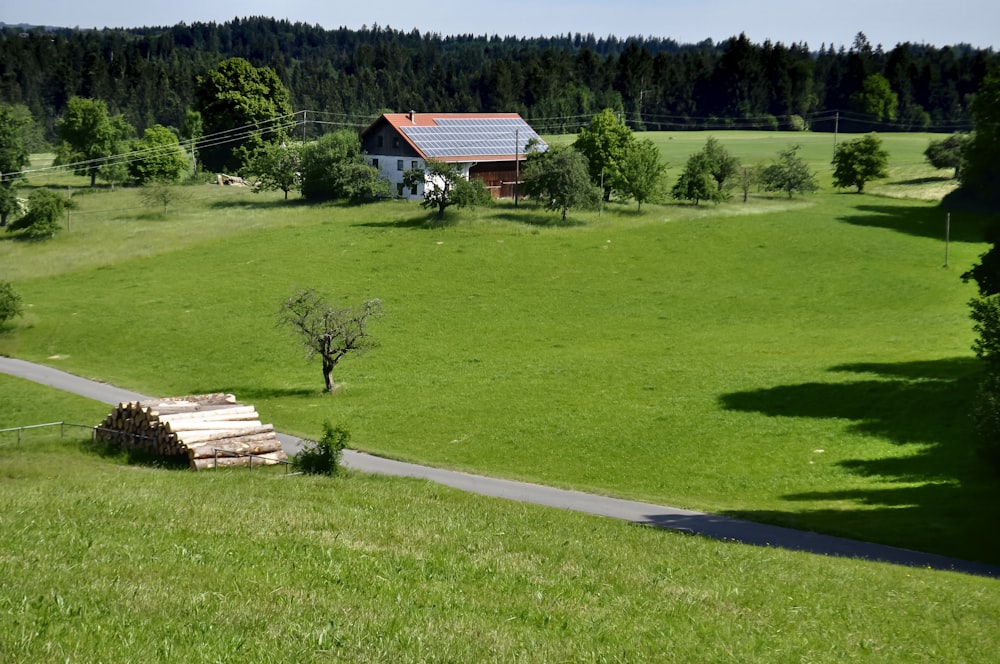 white and brown wooden house on green grass field during daytime