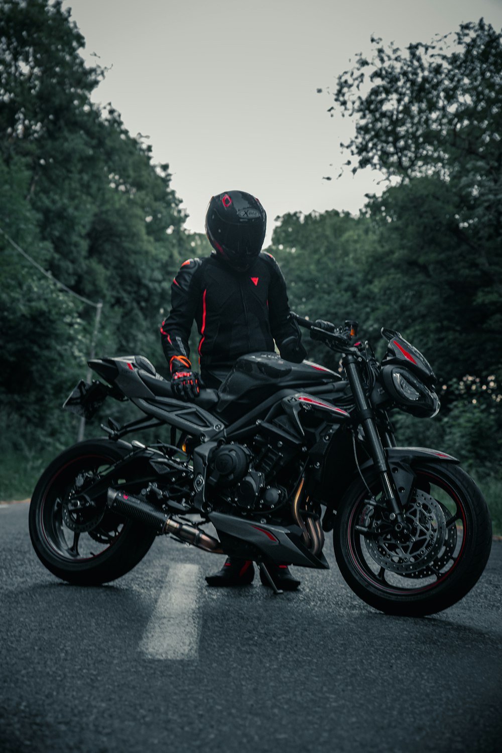 man in black jacket riding black motorcycle