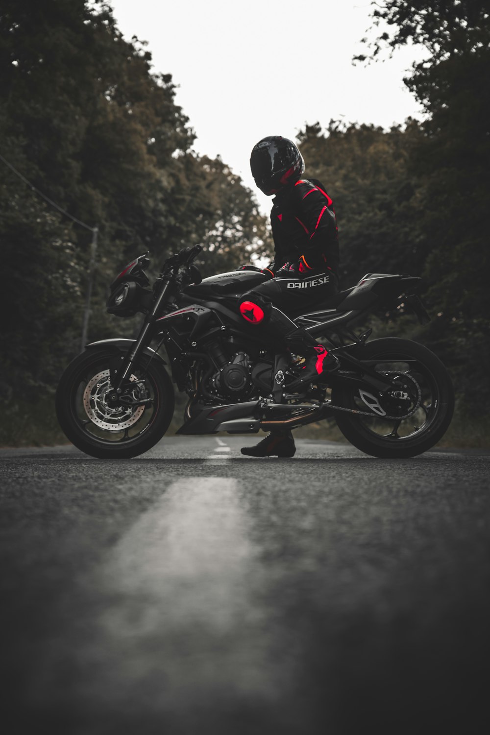 man in black jacket riding black motorcycle