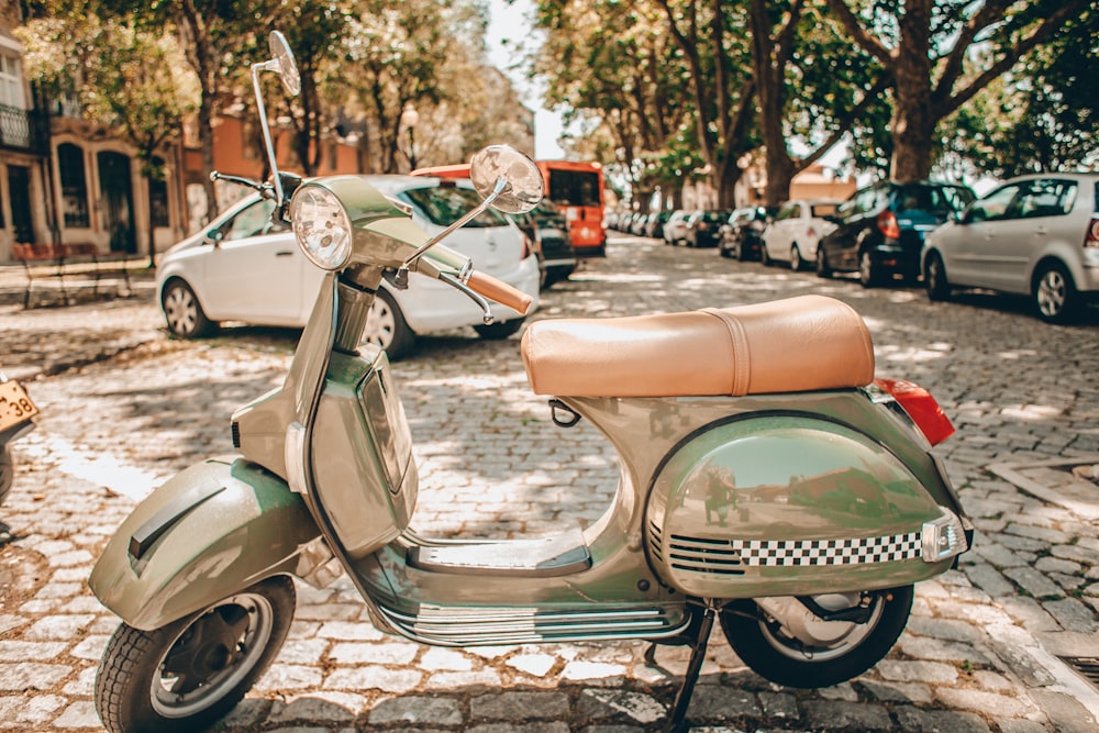 green and brown motor scooter