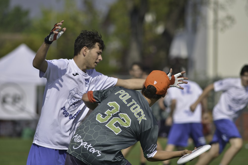 man in white and blue crew neck t-shirt wearing orange helmet