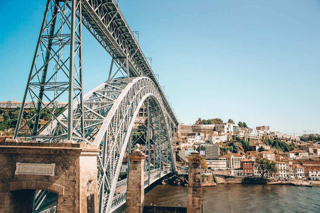 gray metal bridge over river,