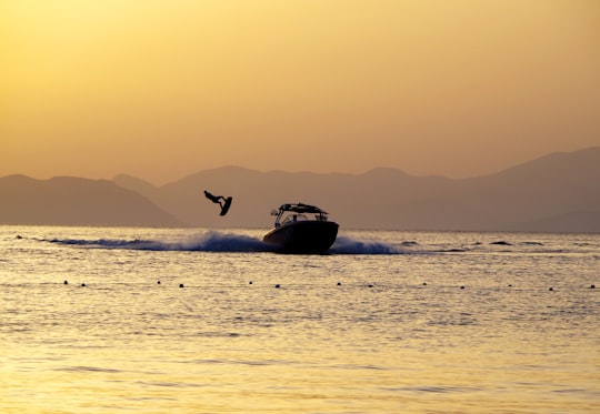 black and white boat on sea during sunset in Fethiye Turkey