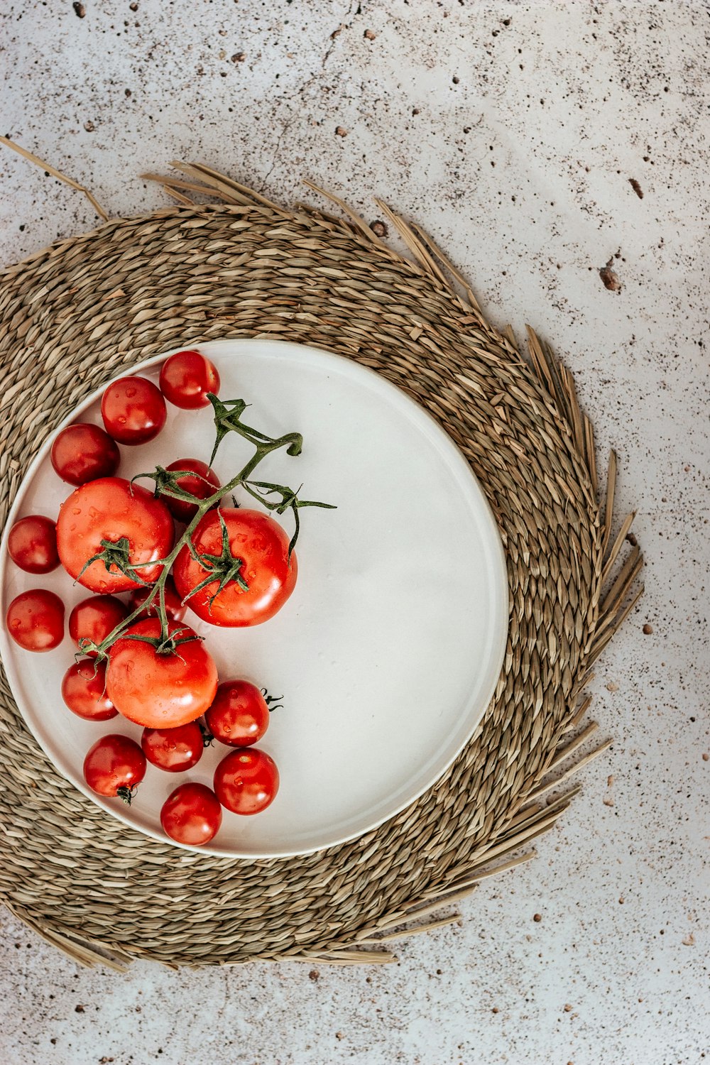 red cherries on white ceramic plate