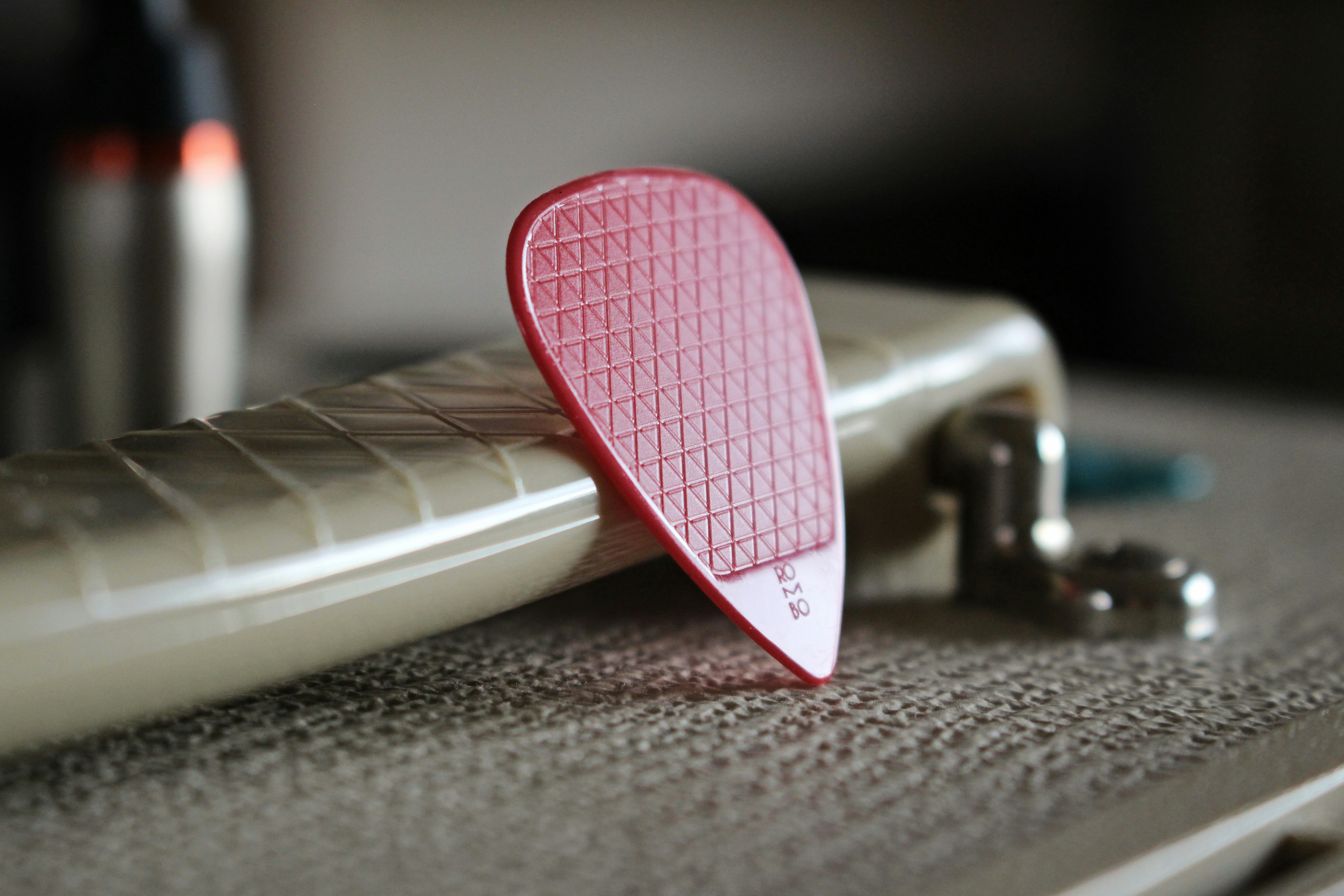 pink heart shaped pendant on gray textile