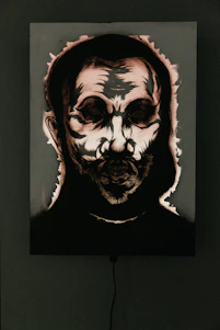 A dark, moody portrait of King Kyroga surrounded by shadowy, gothic elements with golden accents.