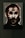A dark and eerie portrait with abstract features, highlighting a skull-like face surrounded by shadows. The image appears to be accentuated by dramatic lighting and high contrast, emphasizing the harsh lines and textures