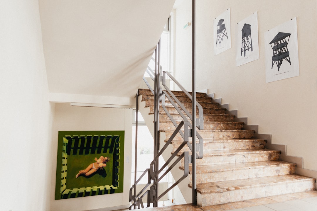 black and white staircase near white wall