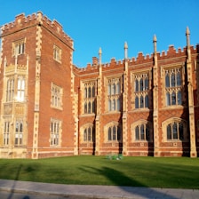 Historic building of the School of Social Sciences & Community Studies bathed in morning light.