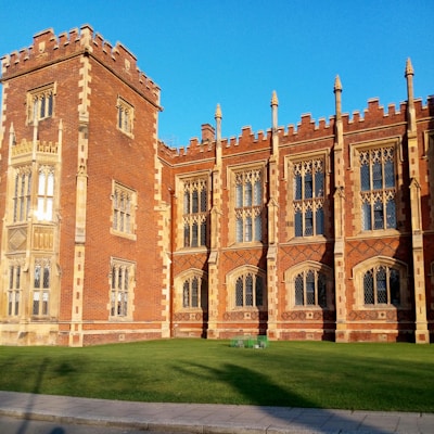 Historic building of the School of Social Sciences & Community Studies bathed in morning light.