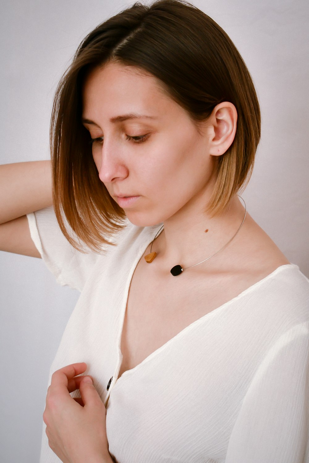 woman in white v neck shirt