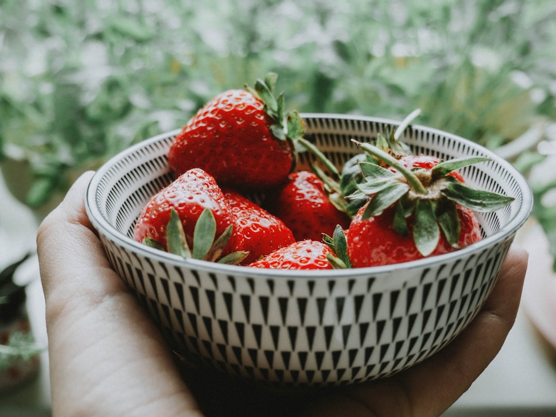 strawberries in white plastic basket