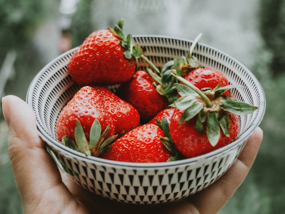 strawberries in white ceramic bowl