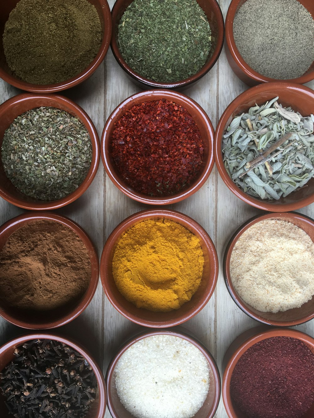 assorted spices in clear glass containers