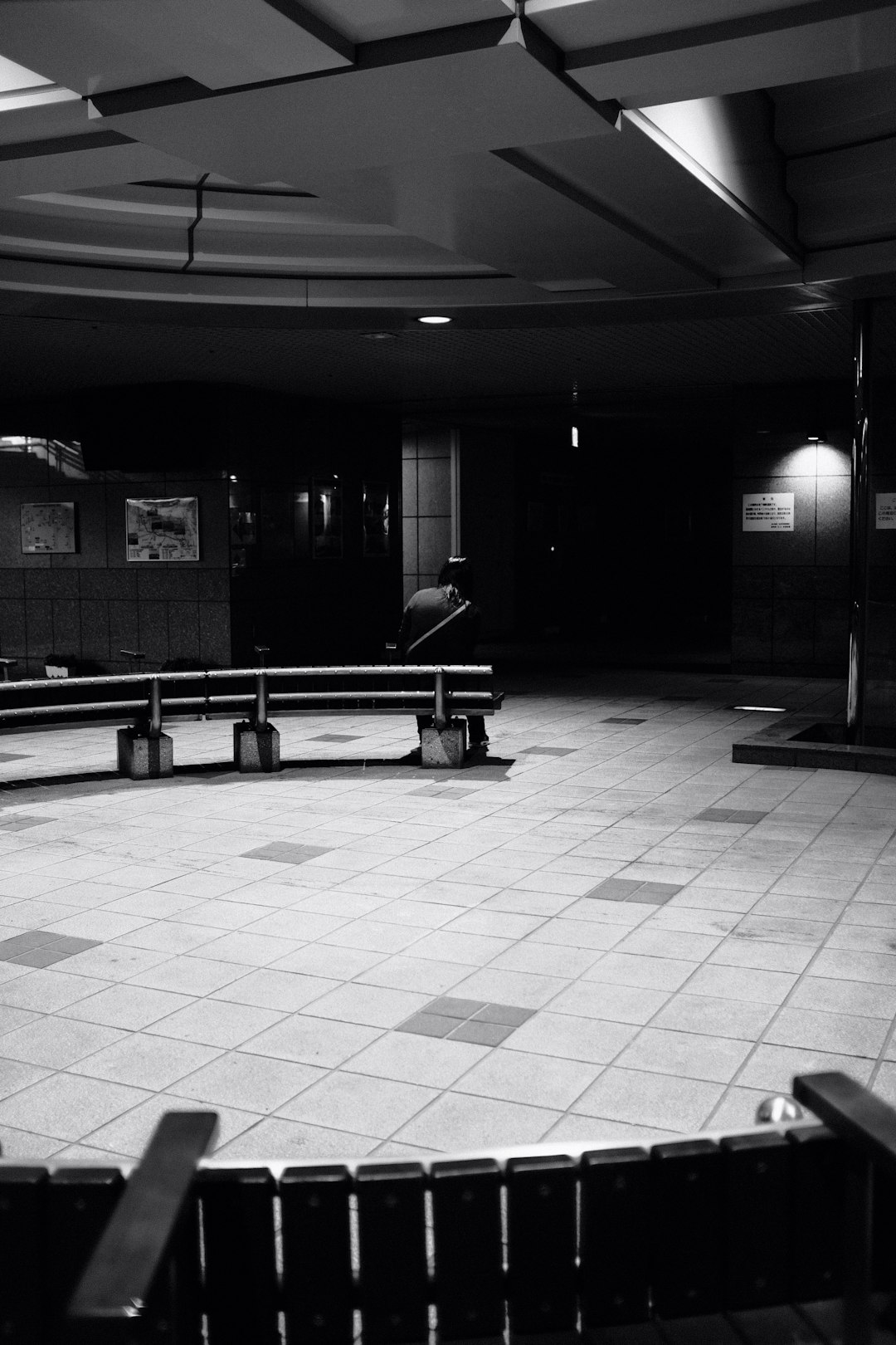 black bench on white floor tiles