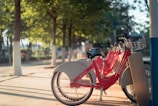 A row of sleek e-bikes parked at the Zapponeta velostation on a sunny day