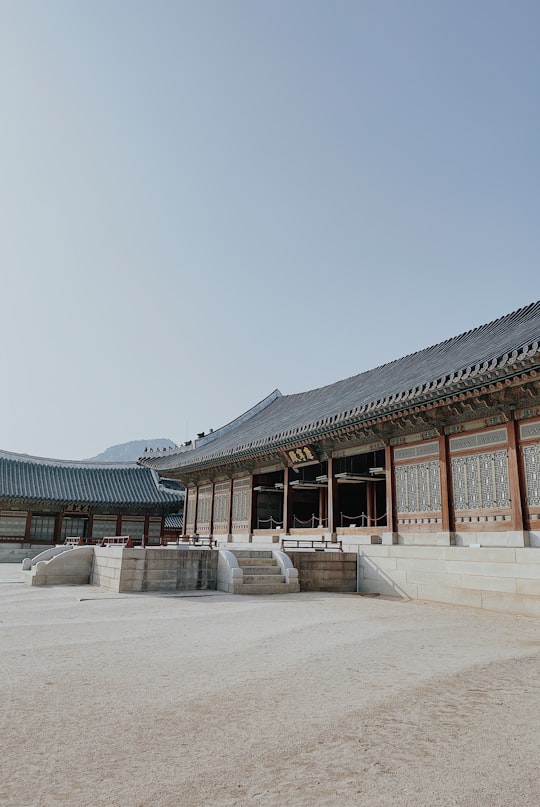 brown and white concrete building under blue sky during daytime in Gyeongbokgung Palace South Korea