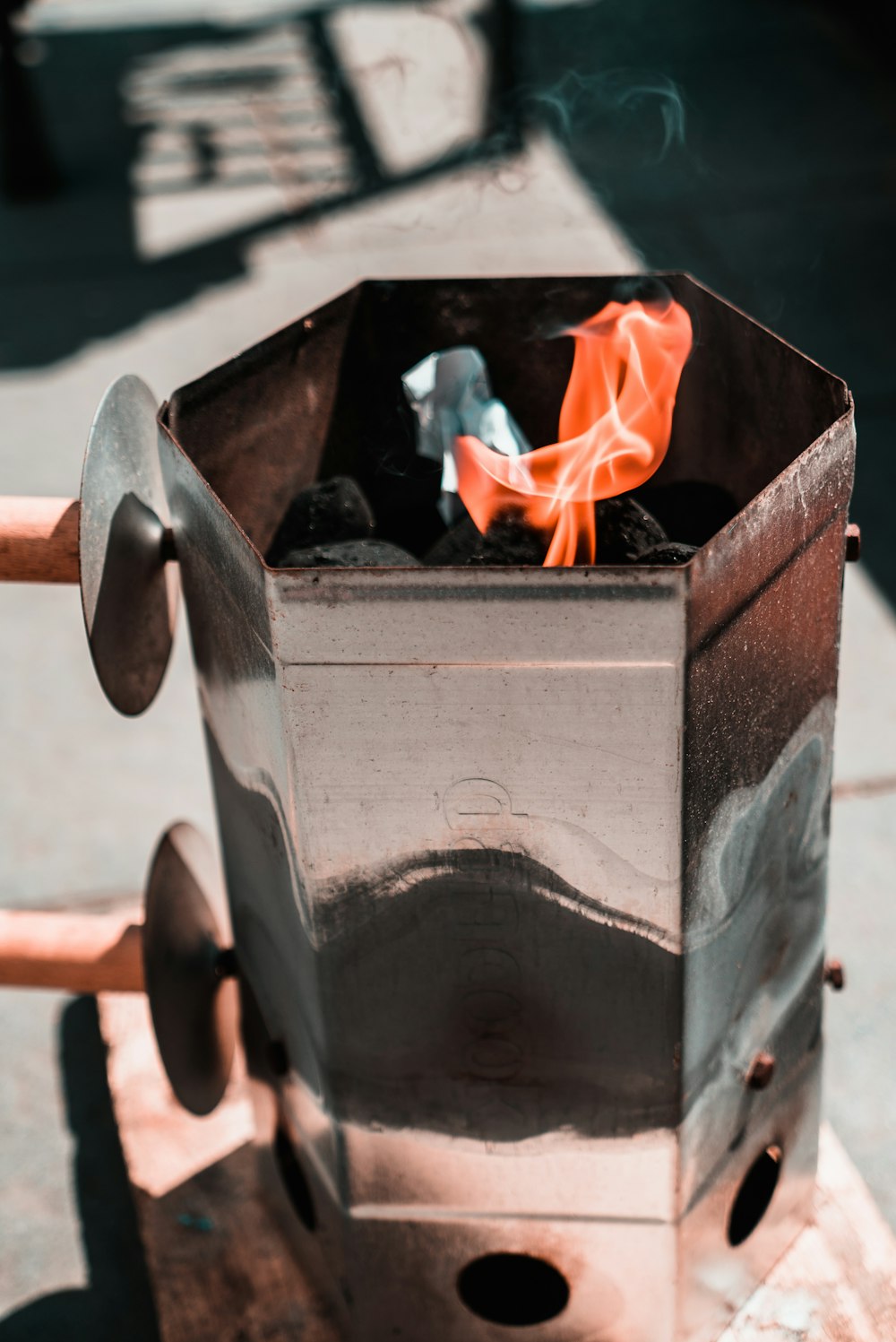 fire in gray metal container