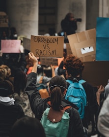 people holding brown wooden board