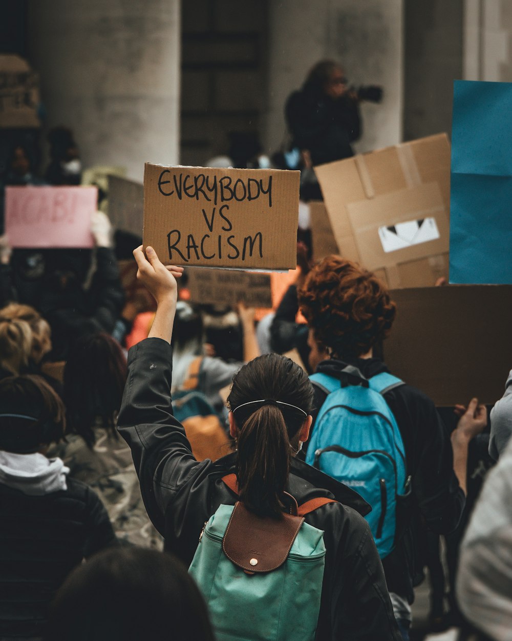 people holding brown wooden board