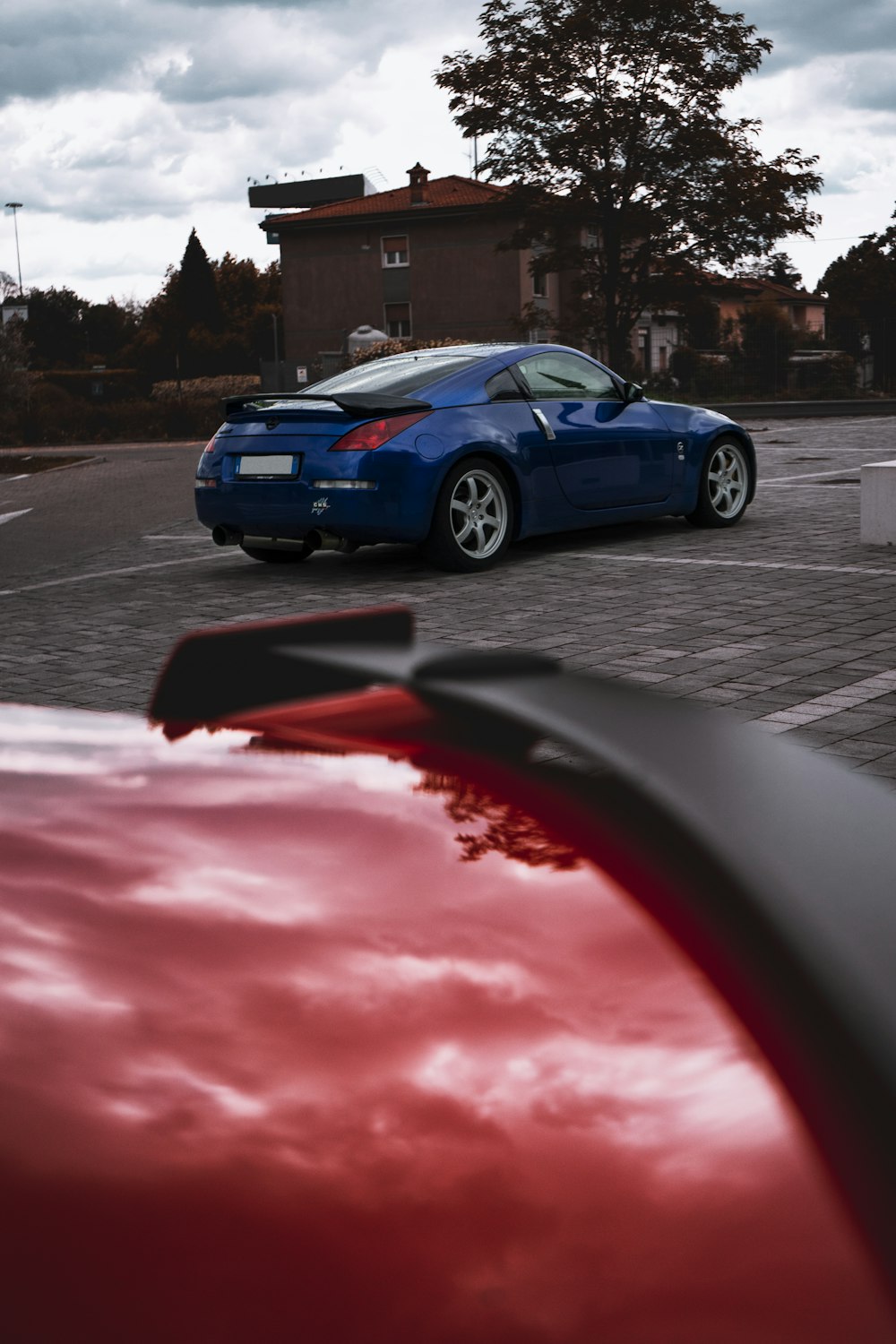 blue porsche 911 on road during daytime