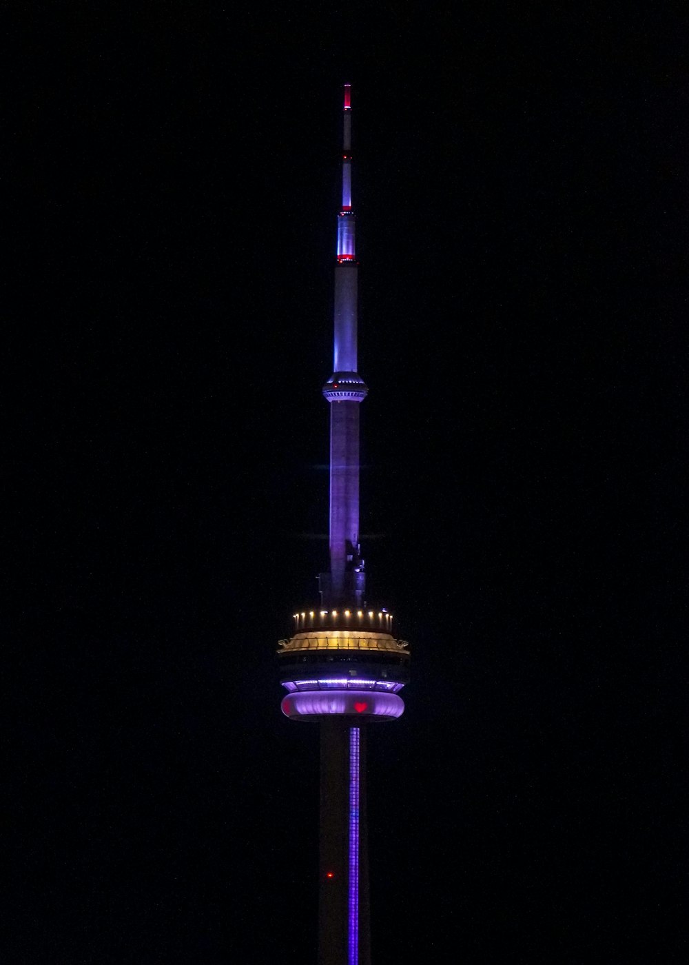 purple and black tower during night time