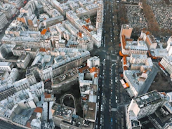 an aerial view of a city with lots of tall buildings