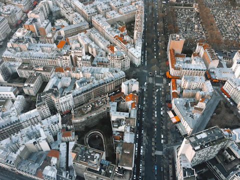 an aerial view of a city with lots of tall buildings