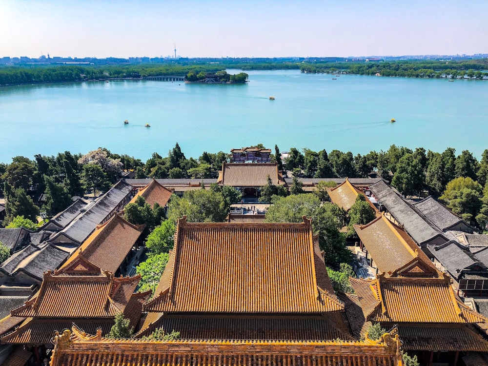 brown roof near body of water during daytime