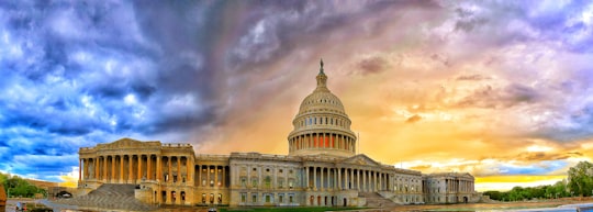 white concrete building under cloudy sky during daytime in United States Capitol United States