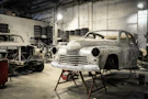 white vintage car in garage