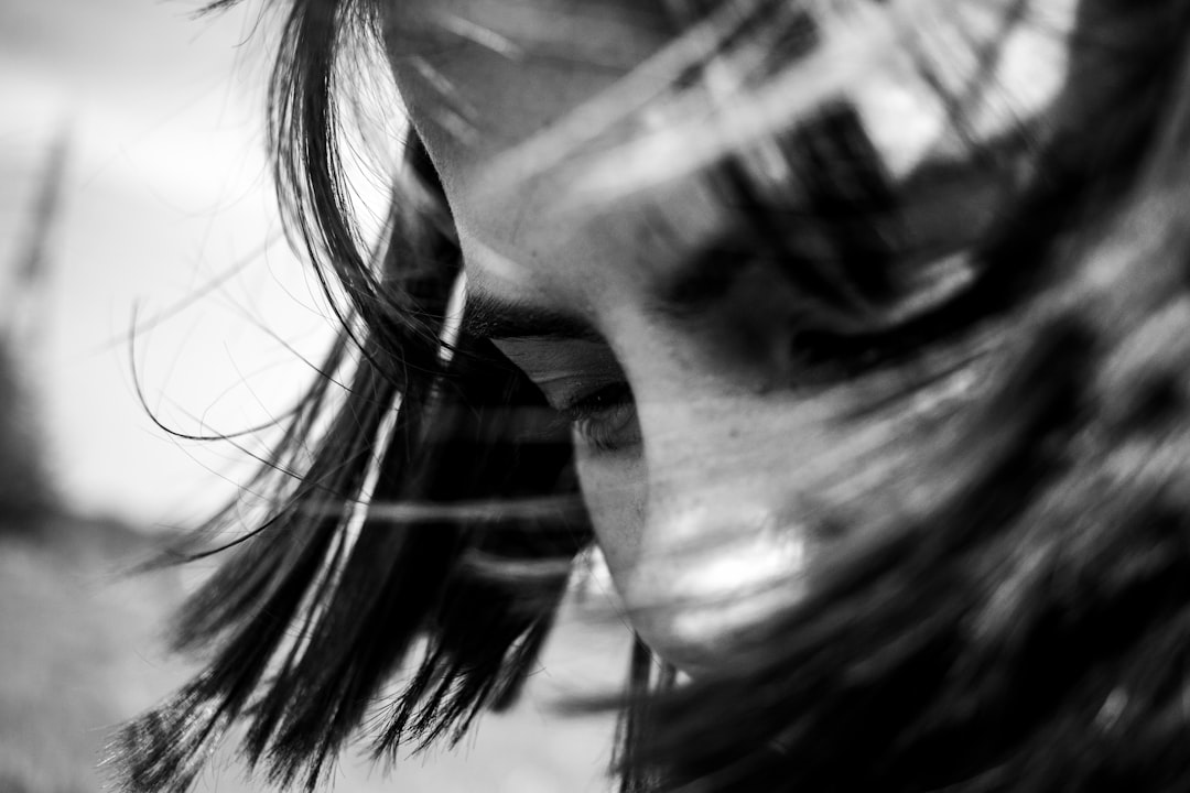 grayscale photo of womans face,