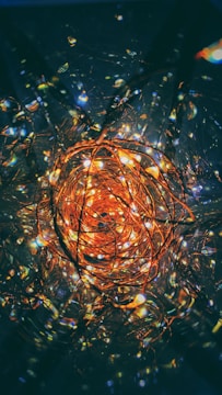 Copper wire coils glowing with a warm metallic hue.