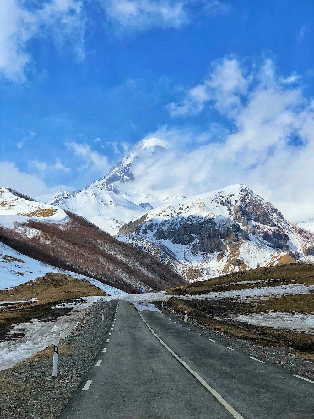 snow covered mountain under blue sky during daytime