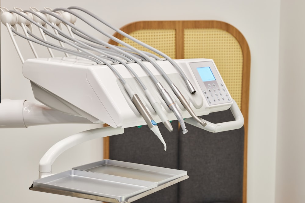 white and gray ip desk phone on black table