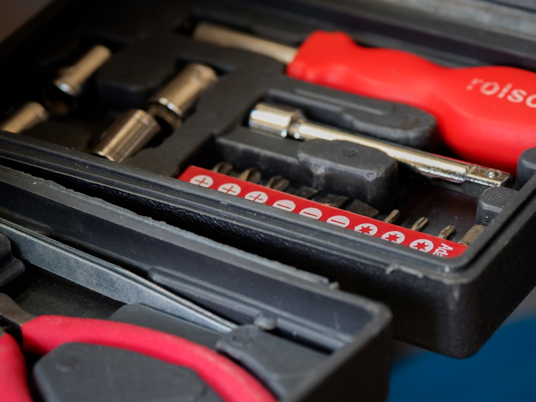 red and black hand tool