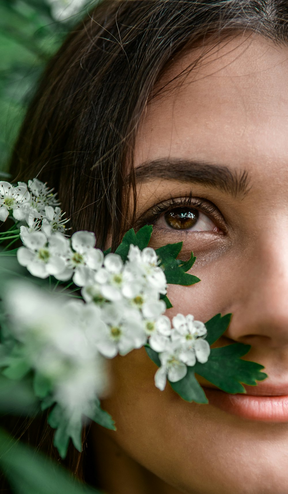 white flowers on womans face