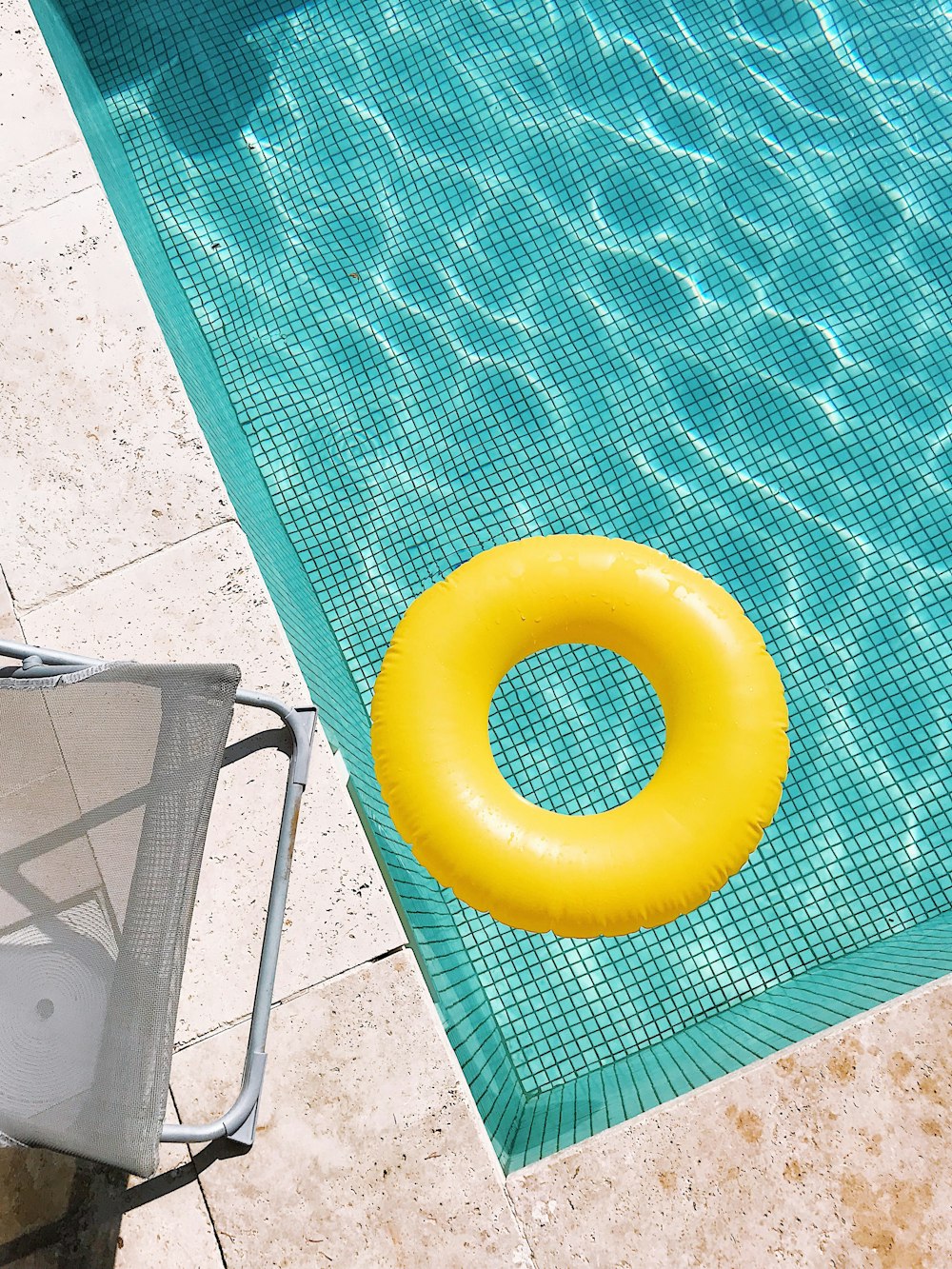 yellow plastic round toy on green table