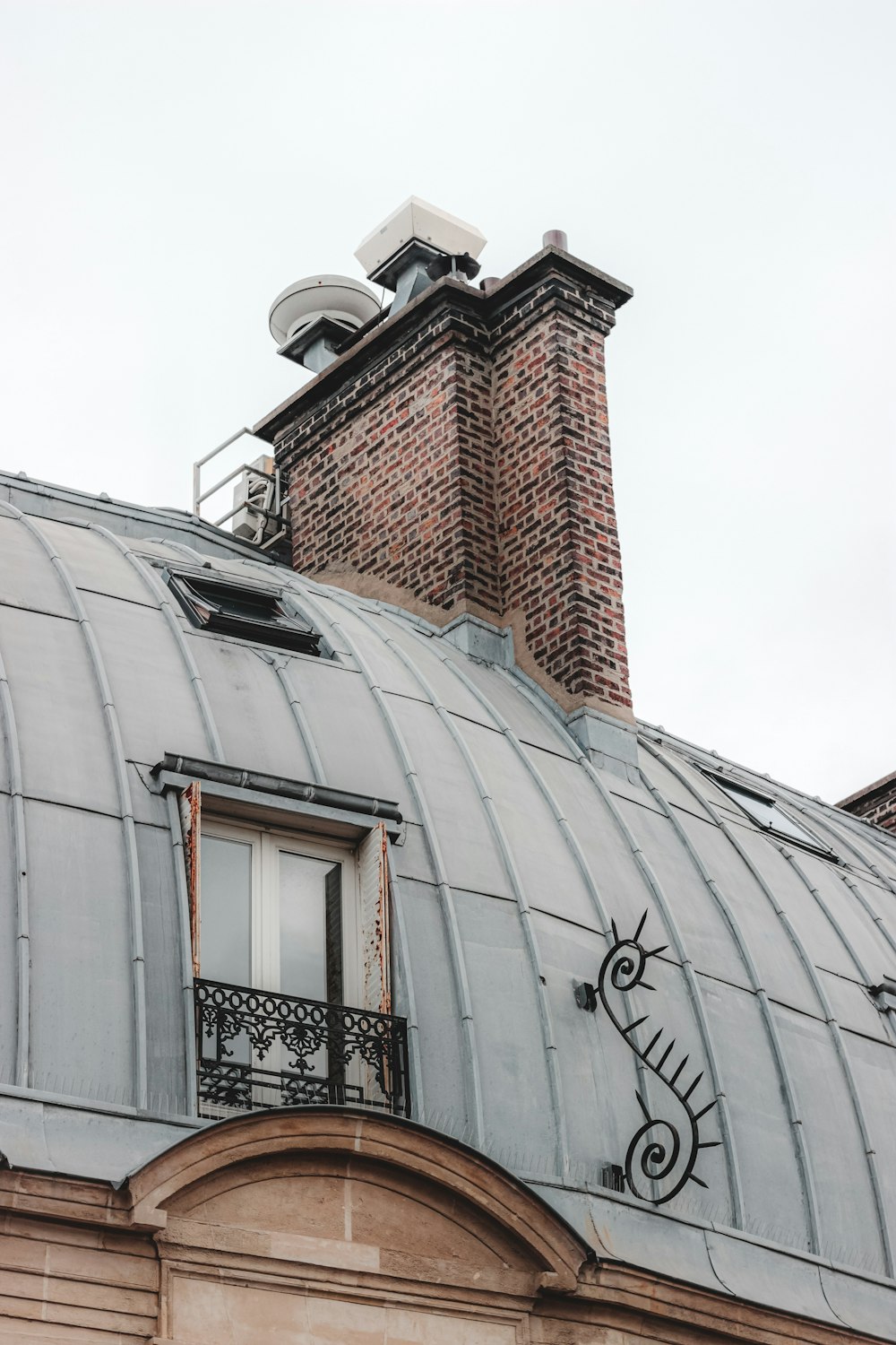 brown brick building under white sky during daytime