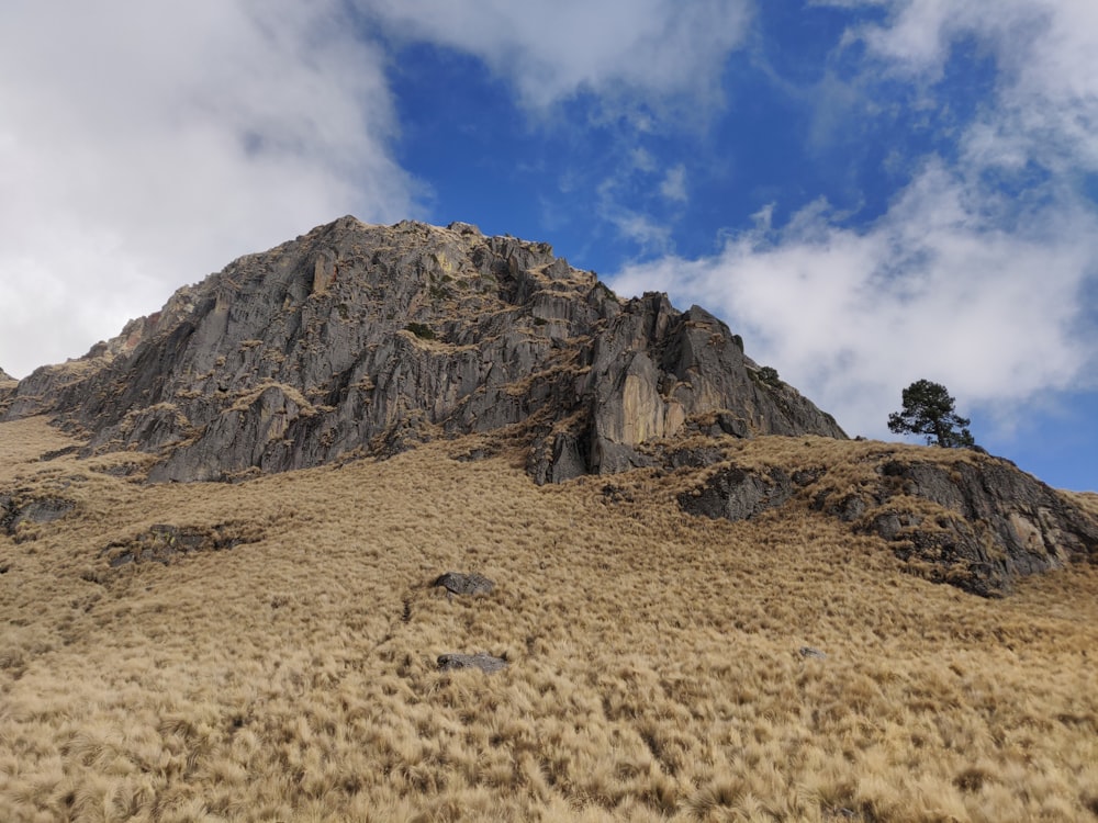 brown rocky mountain under blue sky during daytime