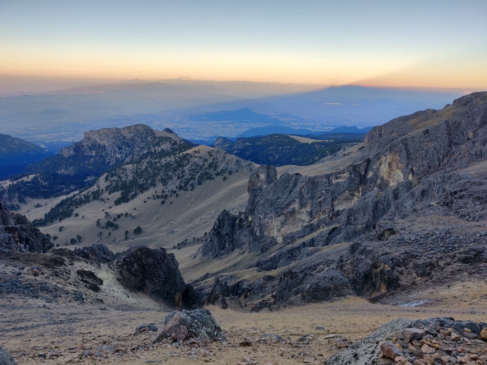 brown rocky mountain under blue sky during daytime