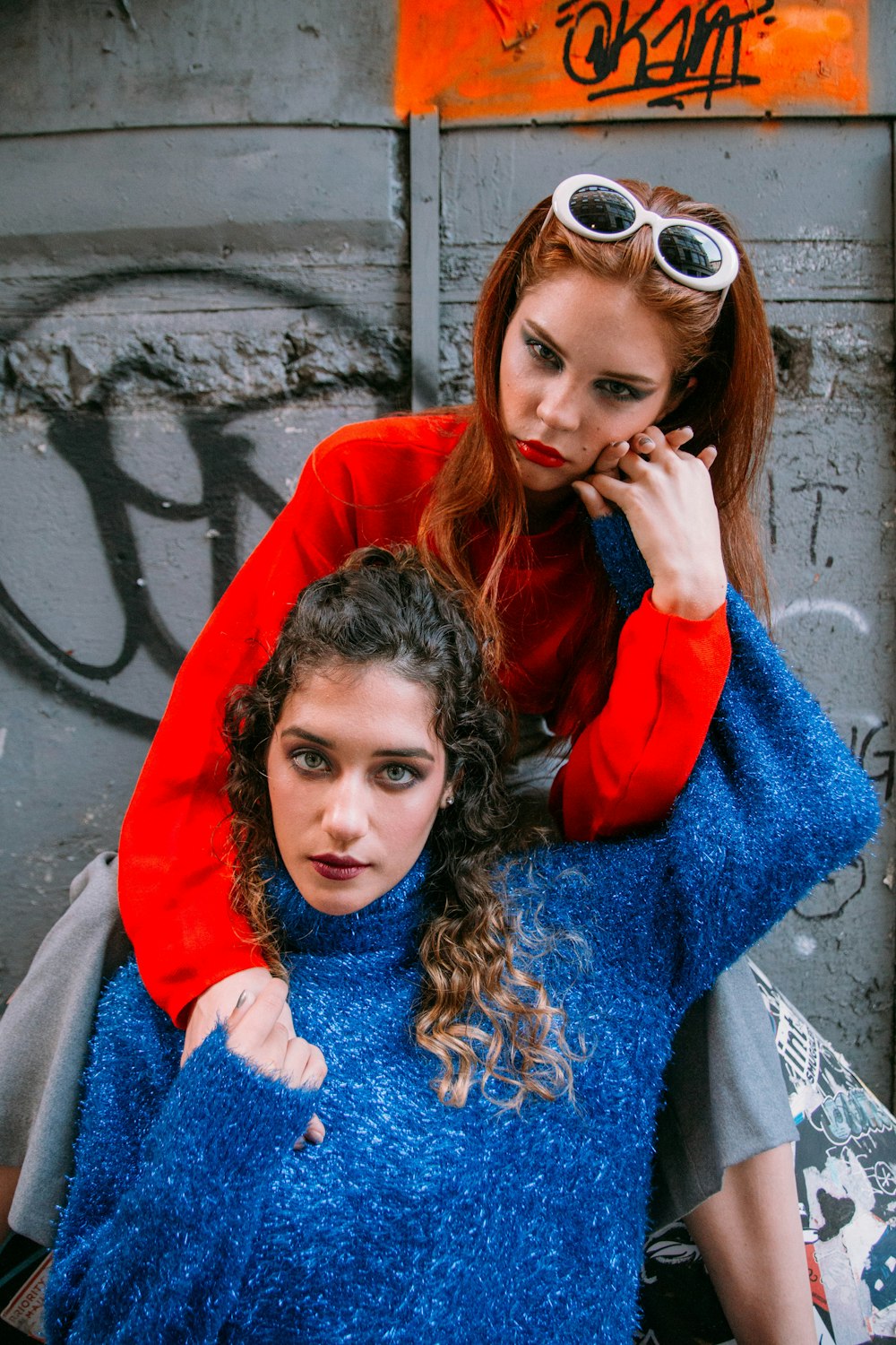 girl in red jacket wearing sunglasses