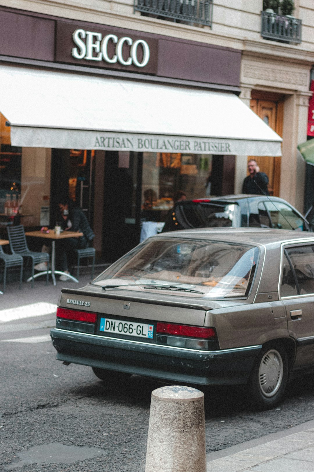 black mercedes benz sedan parked near store during daytime