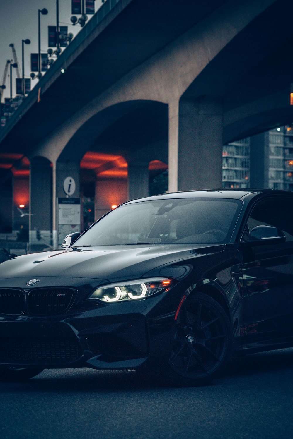 black mercedes benz c class parked near building during night time