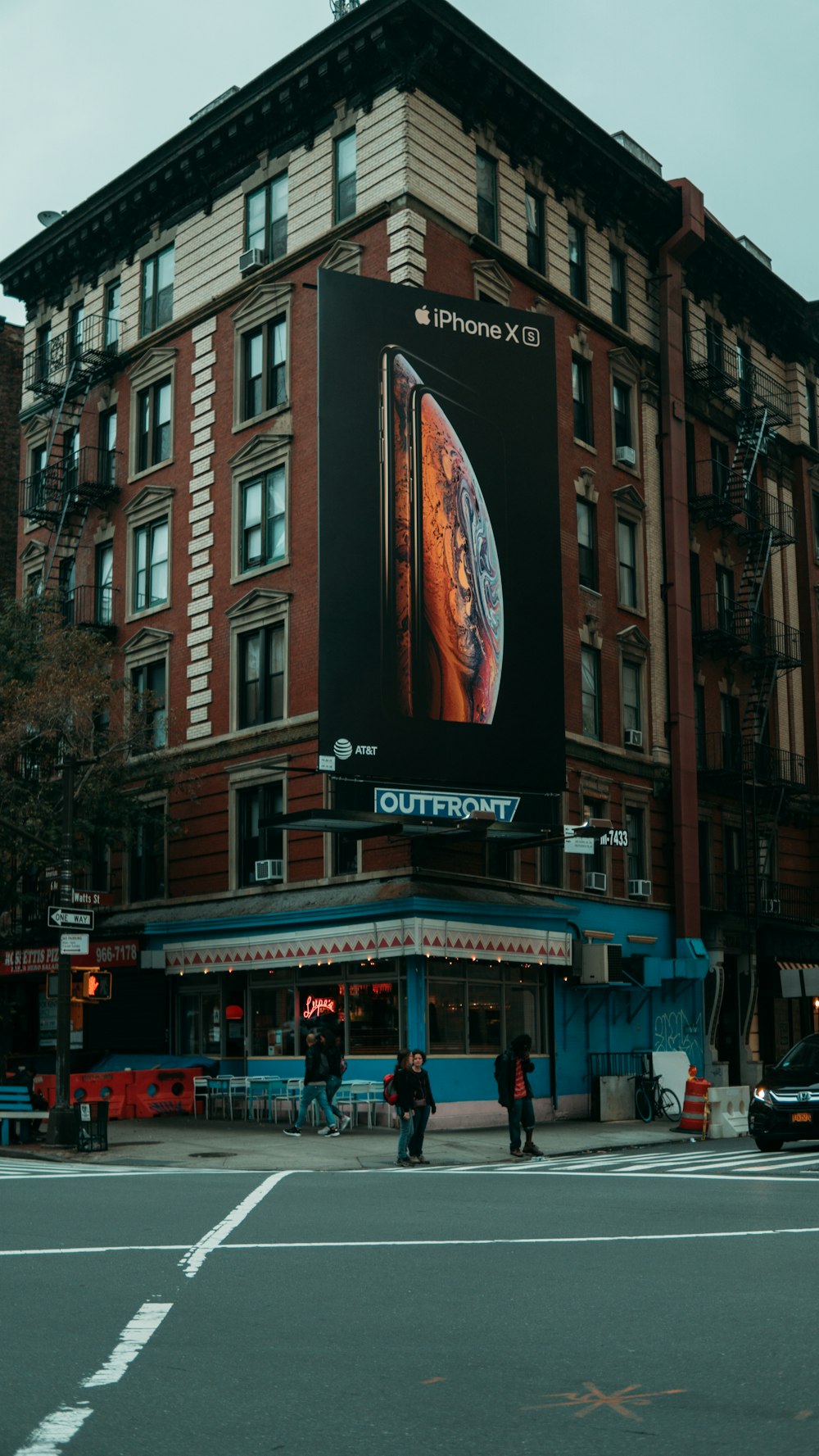 people walking on street during nighttime