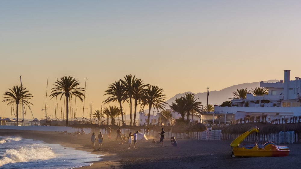 people walking on beach during daytime