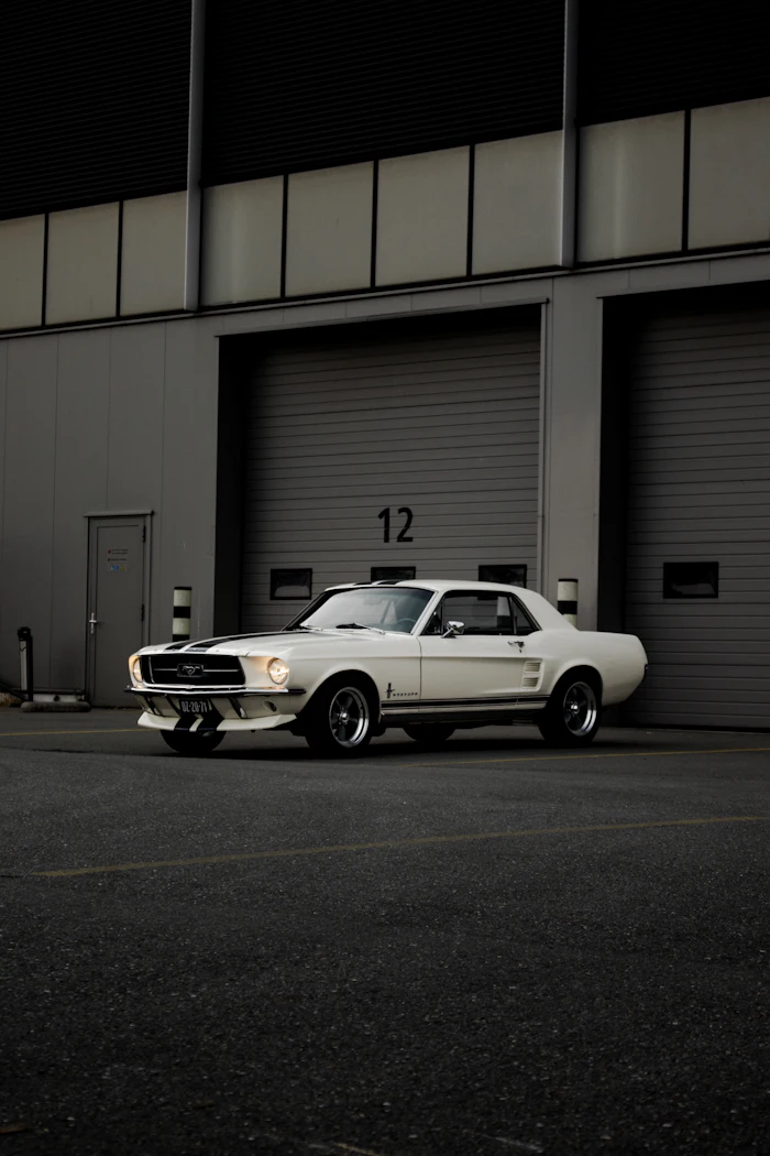 White classic Mustang in a garage