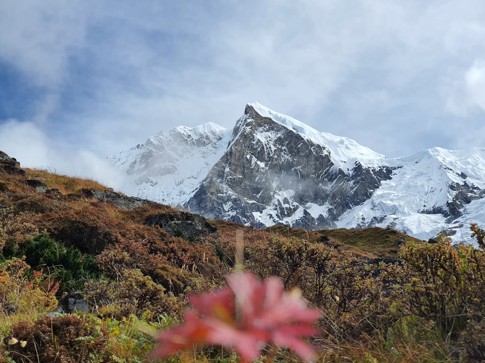 snow covered mountain under cloudy sky during daytime