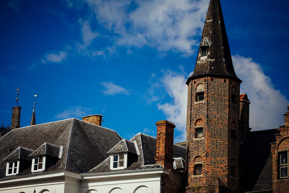 brown brick building under blue sky