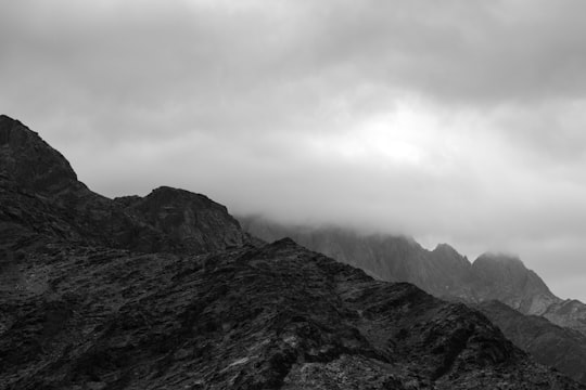 grayscale photo of mountains under cloudy sky in Saint Catherine Egypt